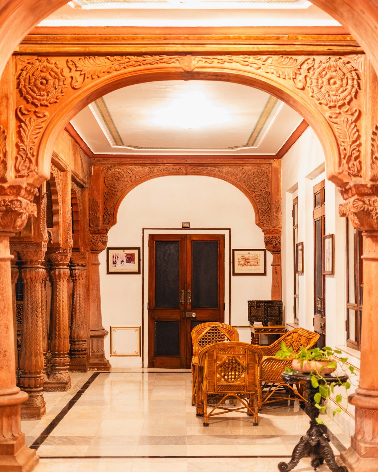Beautifully carved arches and intricate design in a historic Bikaner palace courtyard.