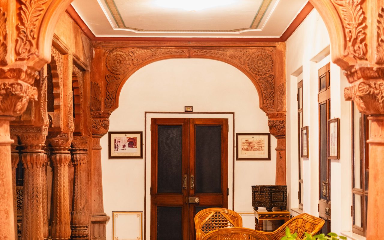 Beautifully carved arches and intricate design in a historic Bikaner palace courtyard.