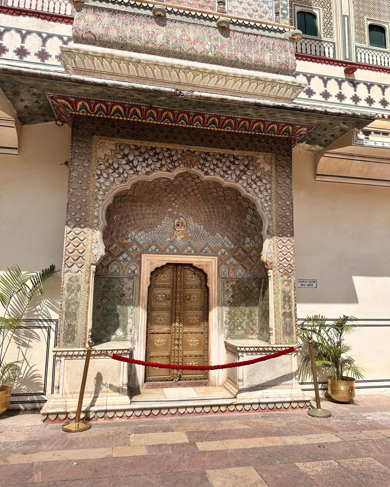 Stunning ornate doorway in City Palace, Jaipur, showcasing traditional Rajasthani architecture.