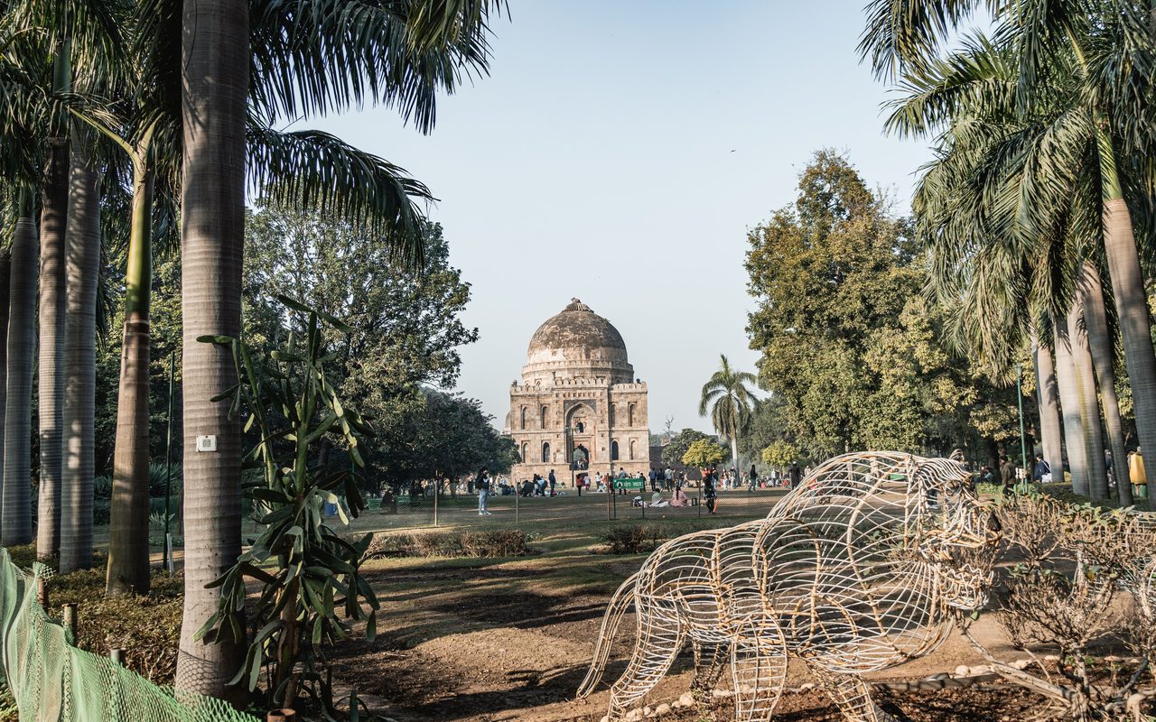Scenic view of Lodhi Garden with historic architecture and lush greenery in New Delhi.