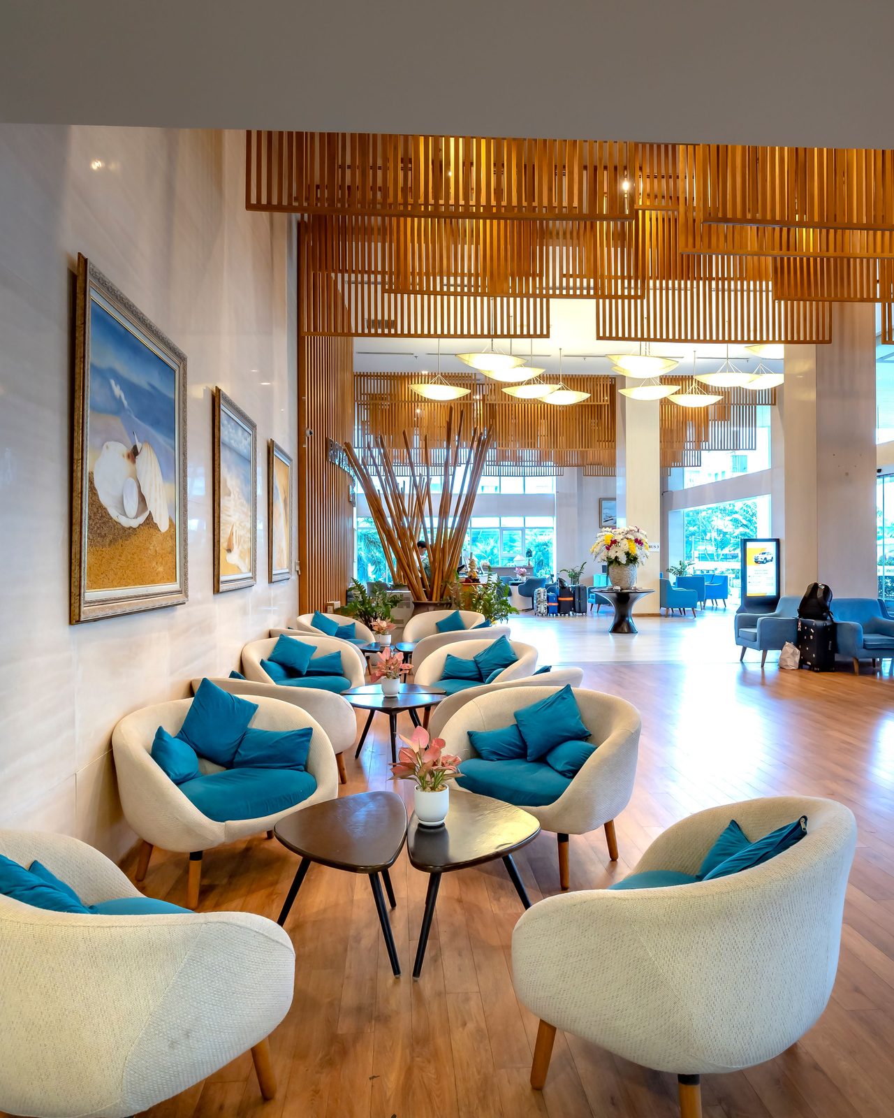 Spacious hotel lobby featuring stylish seating and contemporary decor with natural light.