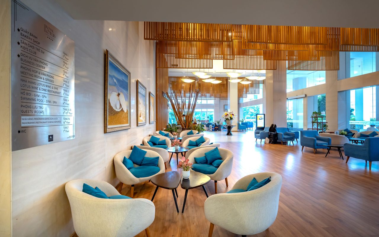 Spacious hotel lobby featuring stylish seating and contemporary decor with natural light.