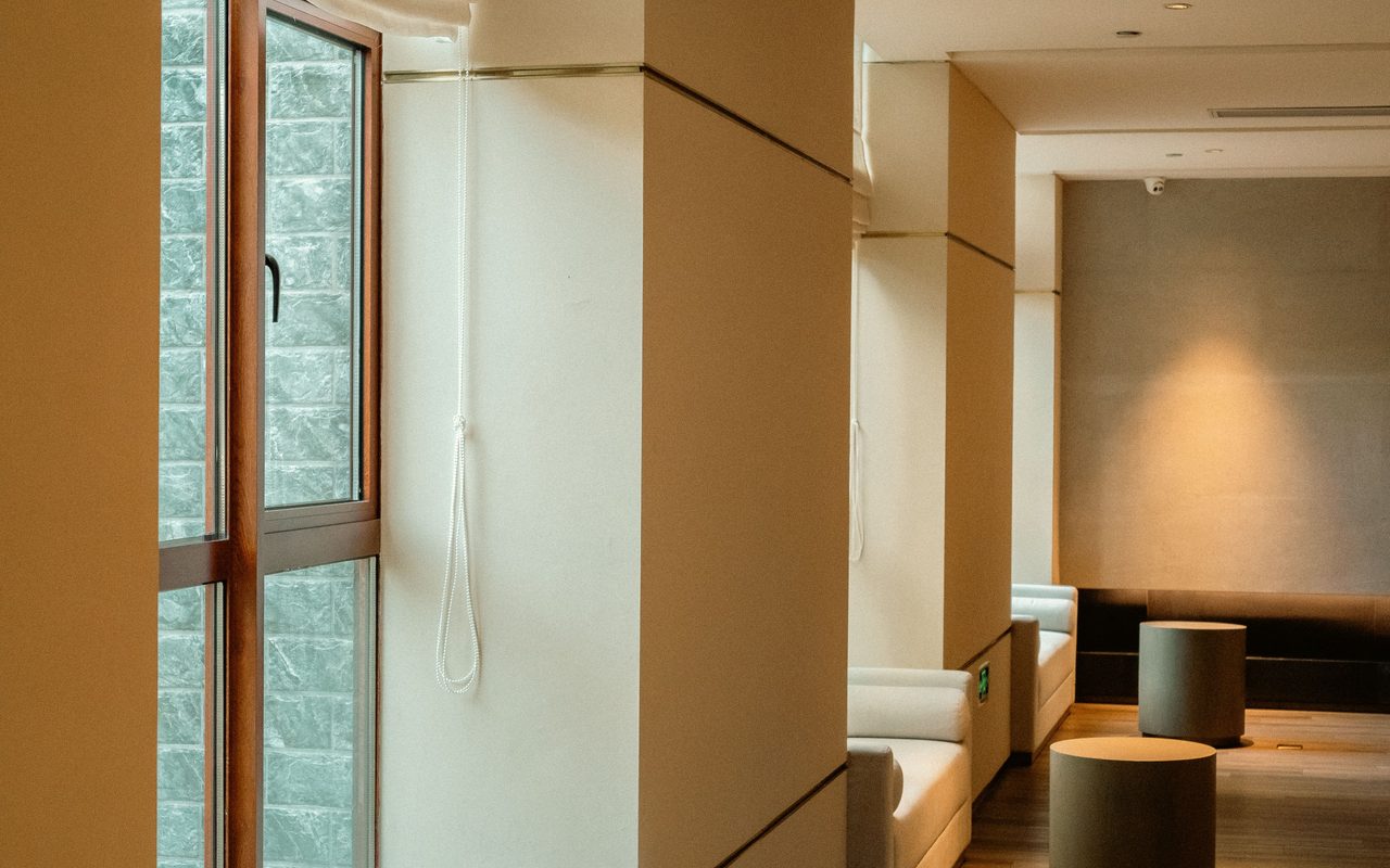 A stylish hotel lounge area with natural lighting and contemporary decor in Hangzhou, Zhejiang, China.