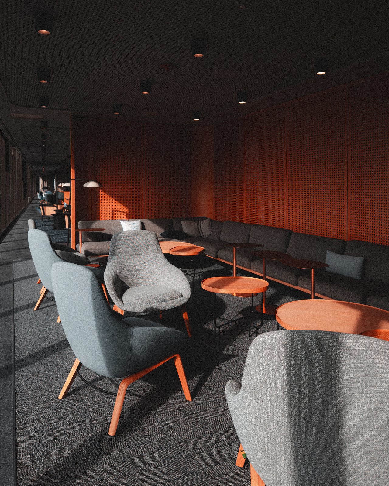 Empty modern lobby with stylish furnishings and soft lighting.