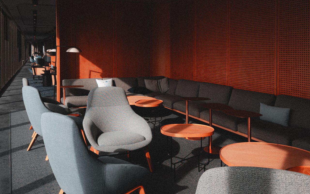 Empty modern lobby with stylish furnishings and soft lighting.