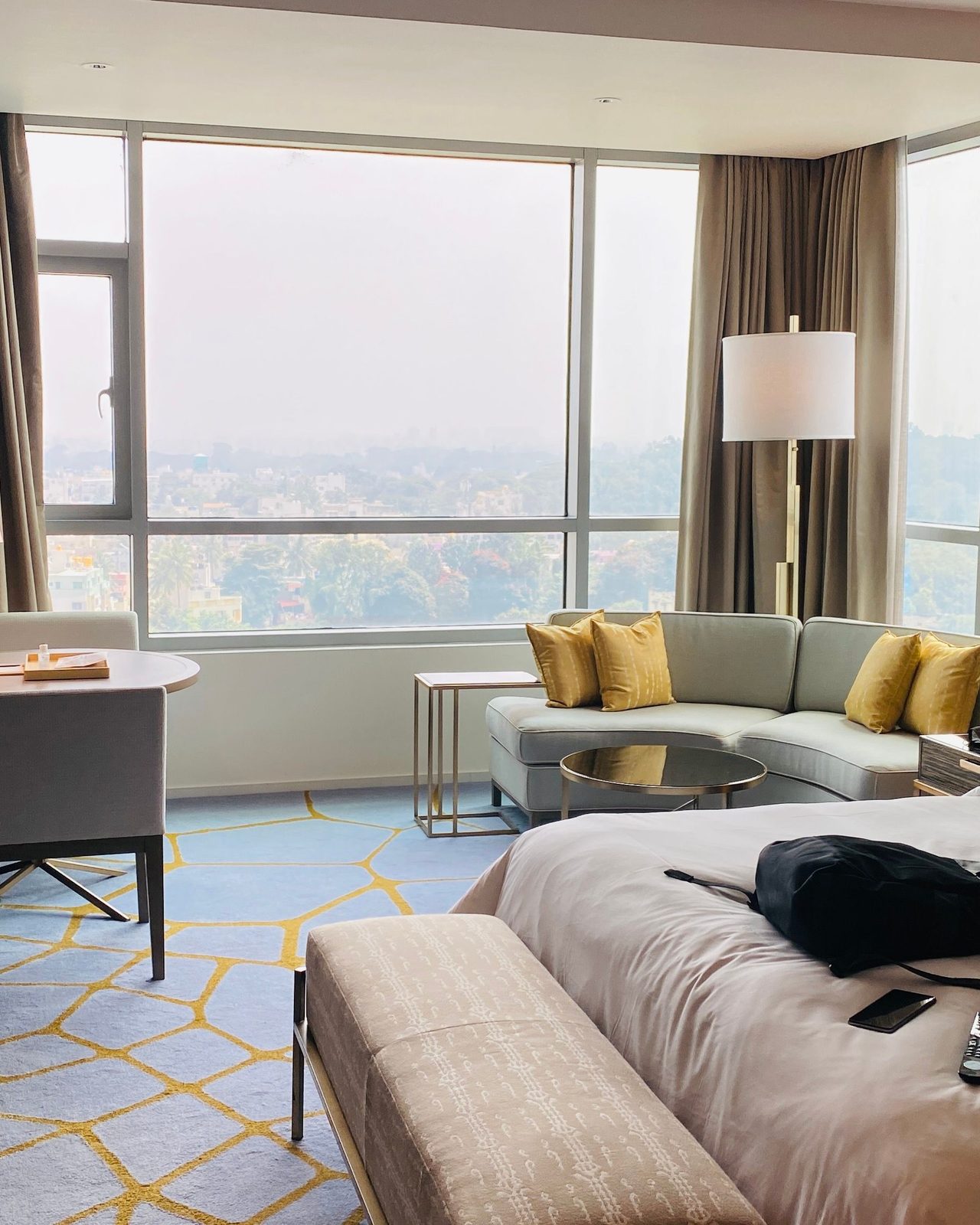 Elegant hotel suite with modern design and city view in Bengaluru.