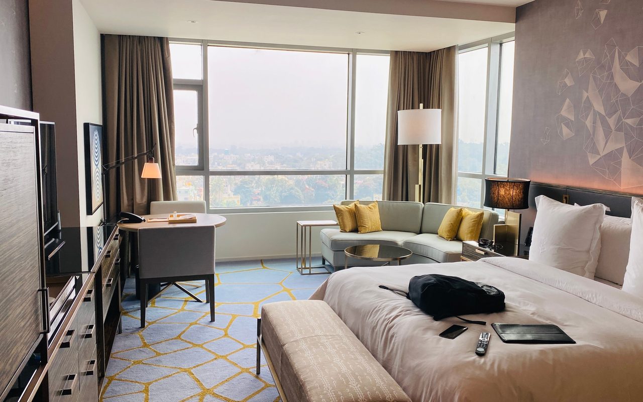 Elegant hotel suite with modern design and city view in Bengaluru.