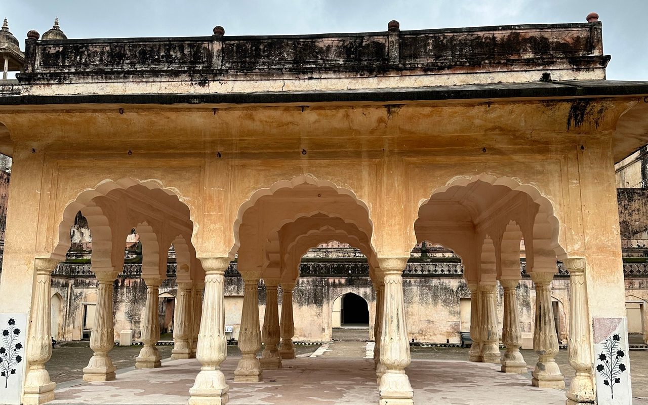 Ancient pavilion showcasing classic arches and stone columns, ideal for travel and architecture themes.