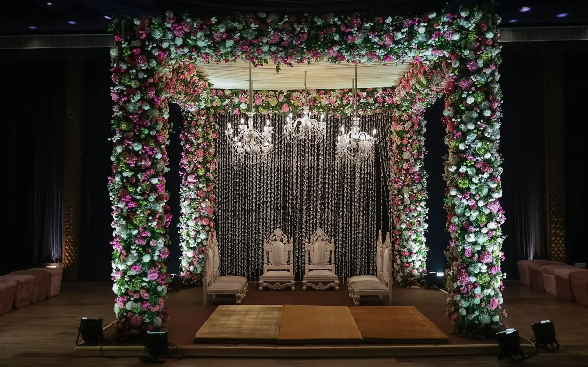 Floral wedding mandap with chandeliers