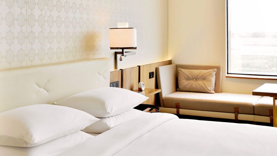 Guest bedroom with a cushioned window seat