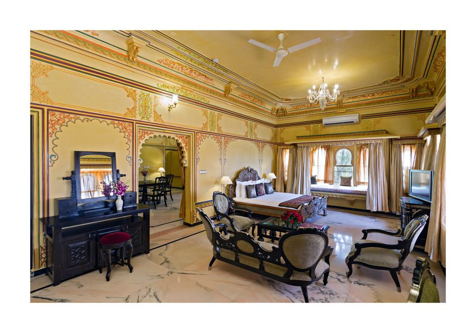 Suite with carved furniture and painted walls