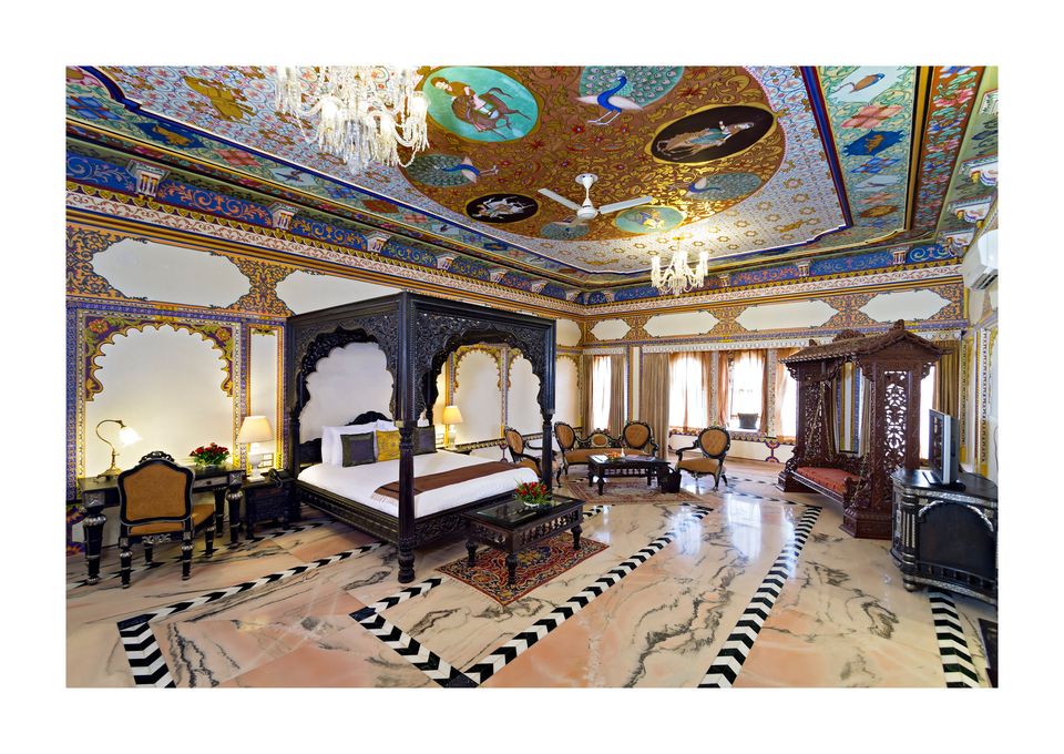 Palace suite beneath a painted blue ceiling