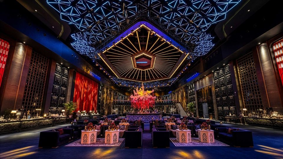 Grand event hall beneath geometric lighting