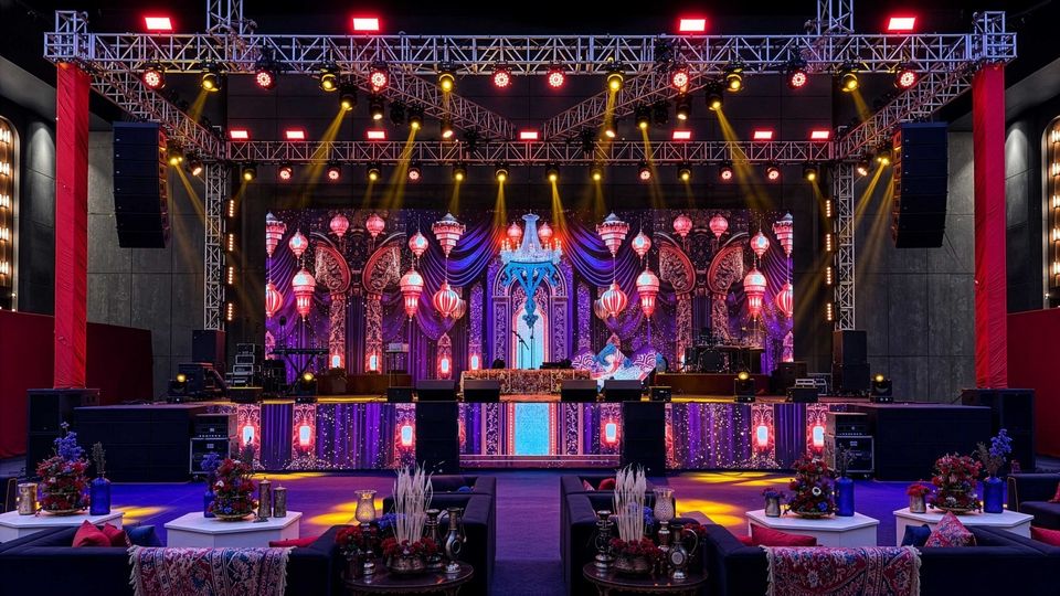 Decorated event stage and banquet tables