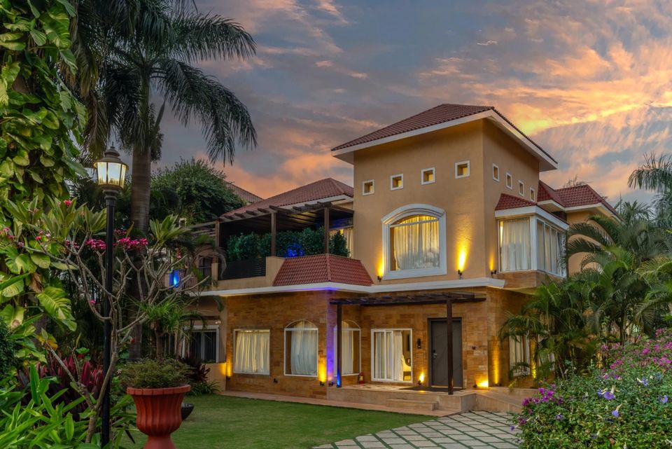 Garden villa beneath an evening sky