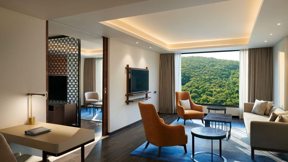 Suite sitting room overlooking forested hills