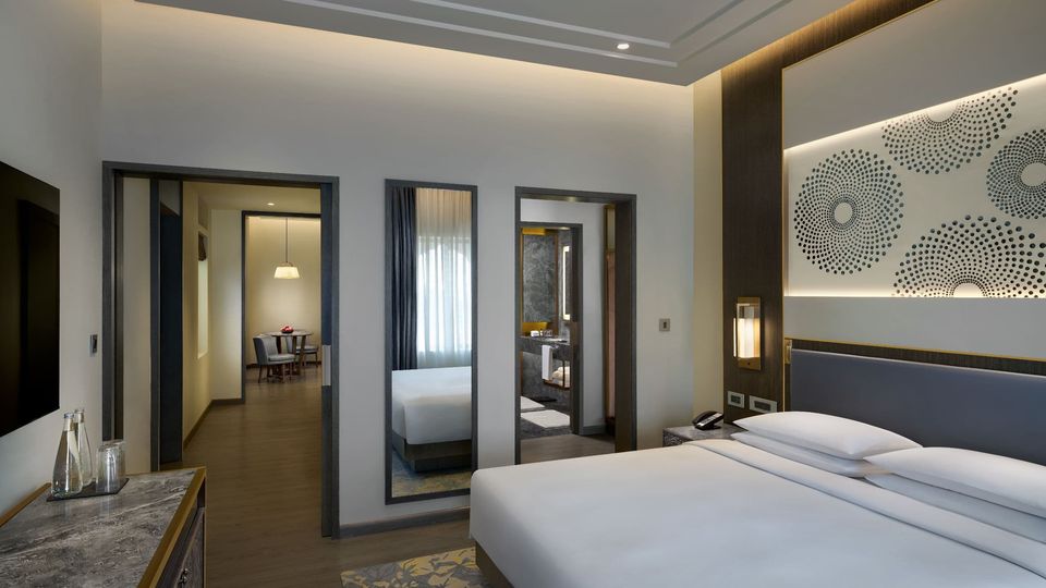 Suite bedroom with patterned wall panels