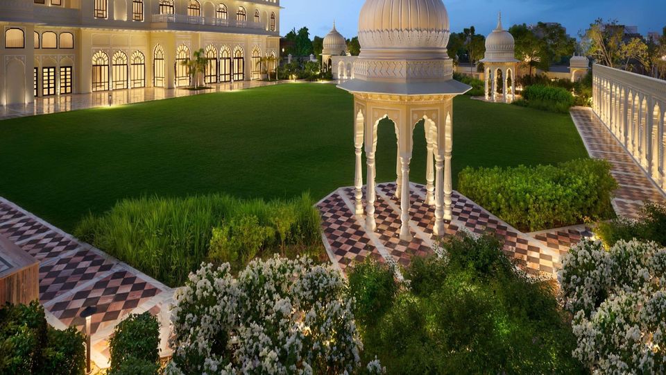 Garden lawn bordered by domed pavilions