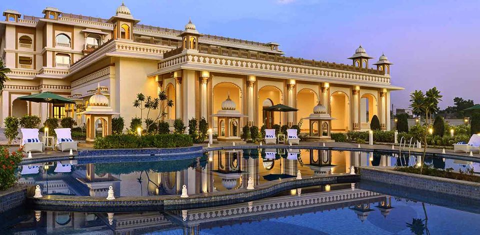 Pool and palace facade at dusk