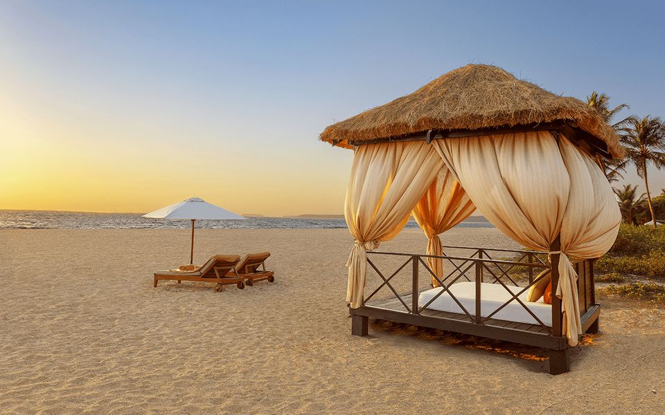 Beach pavilion beside the sea at sunset