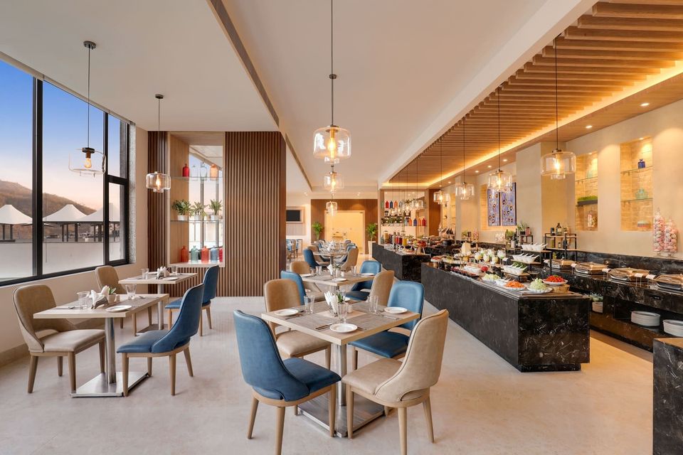 Restaurant tables beside panoramic windows
