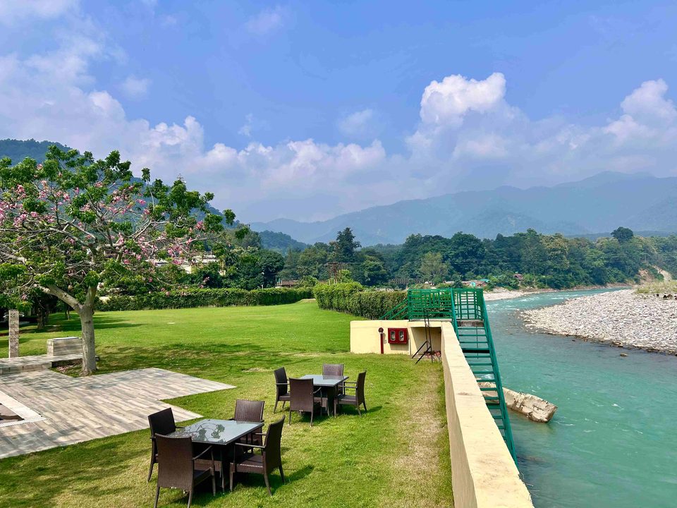 Riverside lawn and seating overlooking the hills