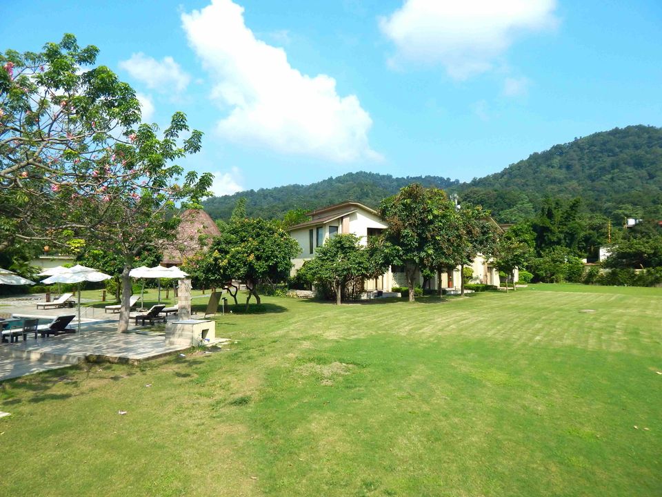 Broad garden lawn with cottages beyond