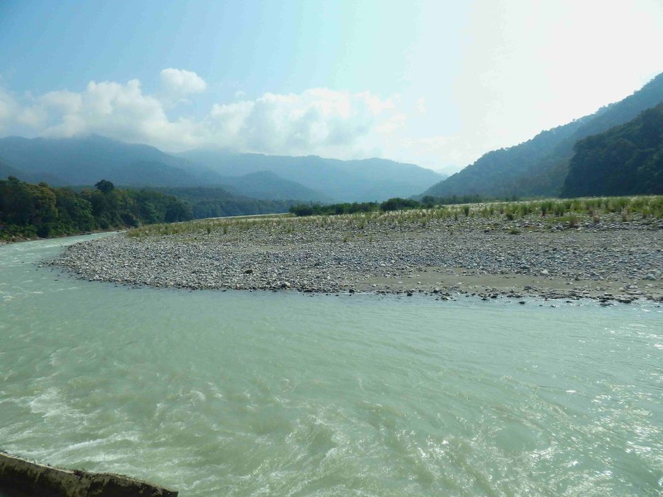 River and forested hills beside the resort