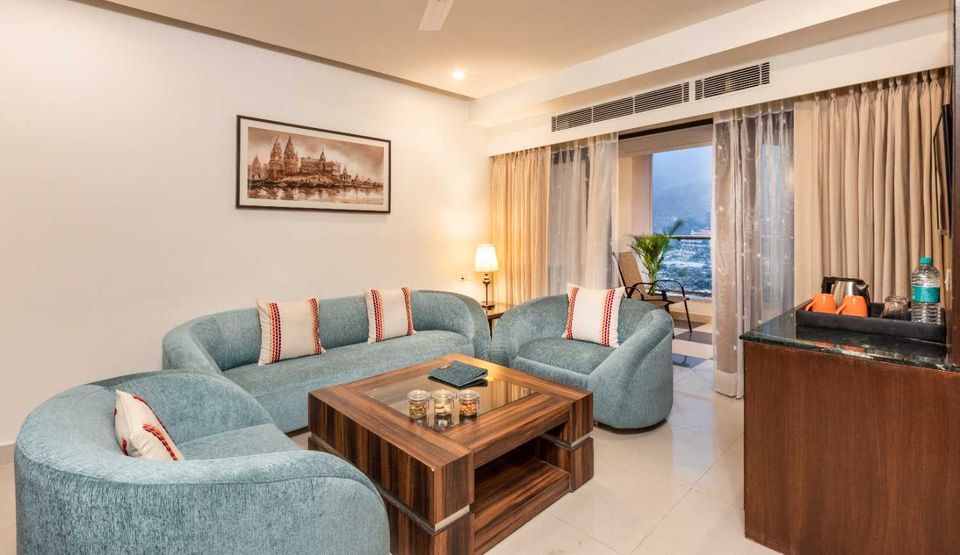 Suite sitting room with teal sofas
