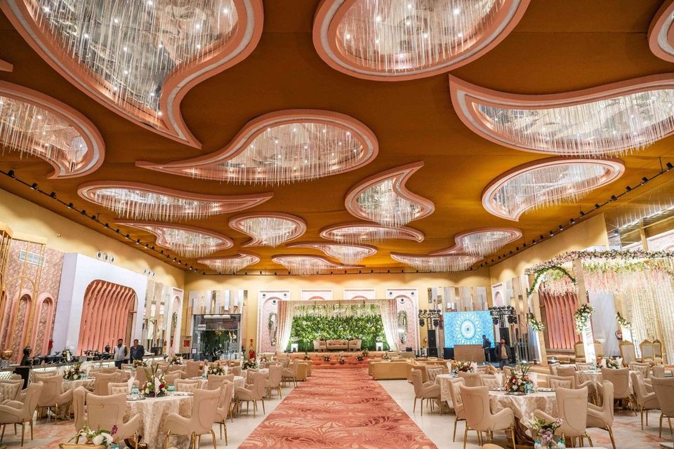 Grand banquet hall with sculpted ceiling and chandeliers