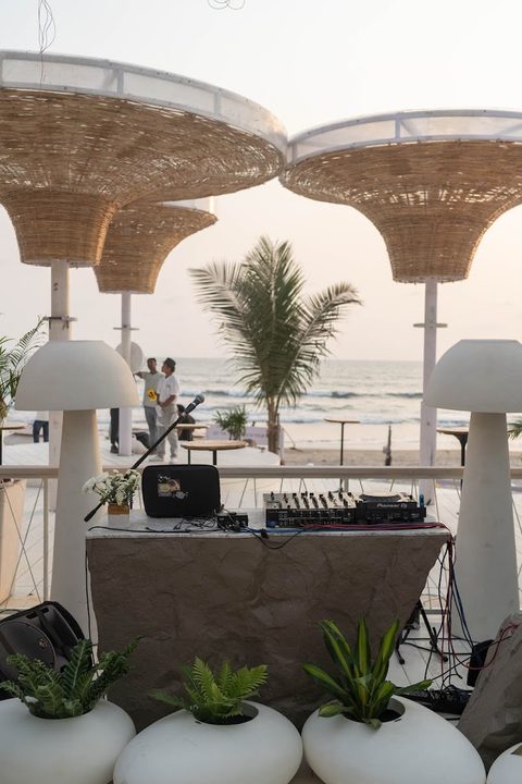 DJ deck with sea view and woven canopy shades at Morjim Culture
