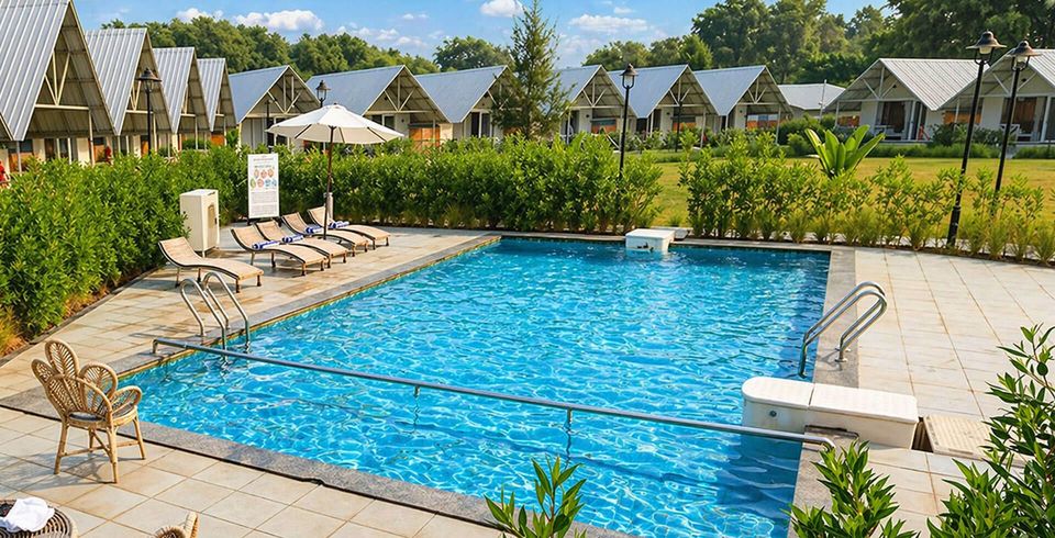 Pool bordered by garden hedges