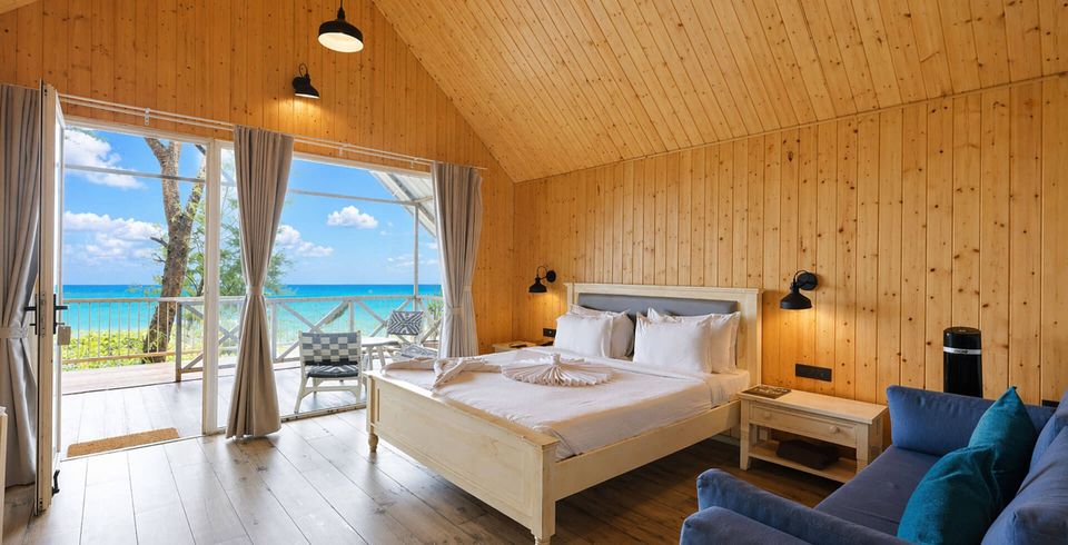 Cottage bedroom opening towards the coast