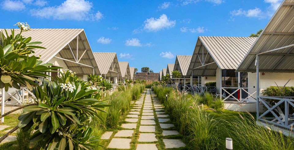 Garden avenue between pitched-roof cottages