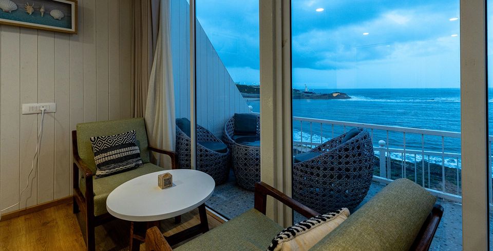 Seating by a window overlooking the sea