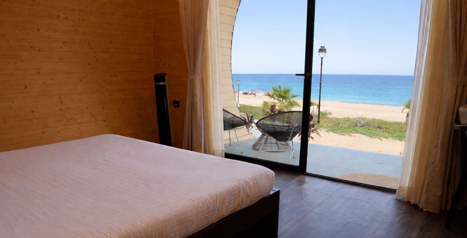 Guest bedroom opening onto the sea