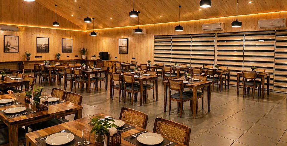 Wood-lined restaurant with warm pendant lights