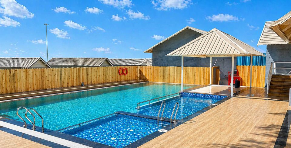 Outdoor pool beside a wooden deck