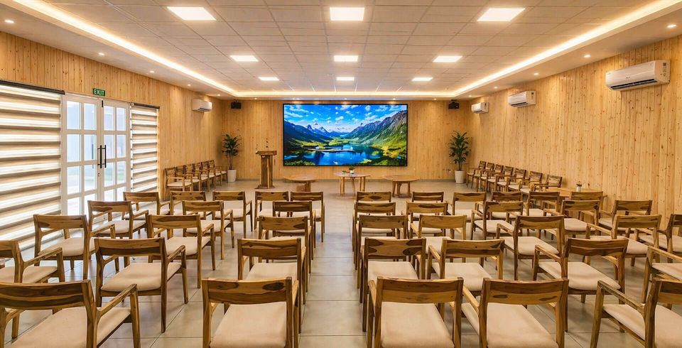 Event room arranged with tables and chairs