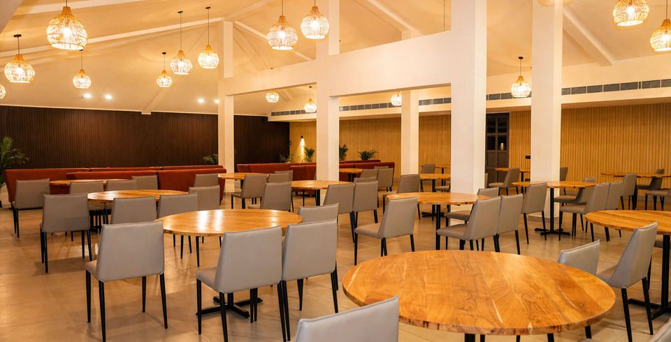 Dining tables under warm pendant lights