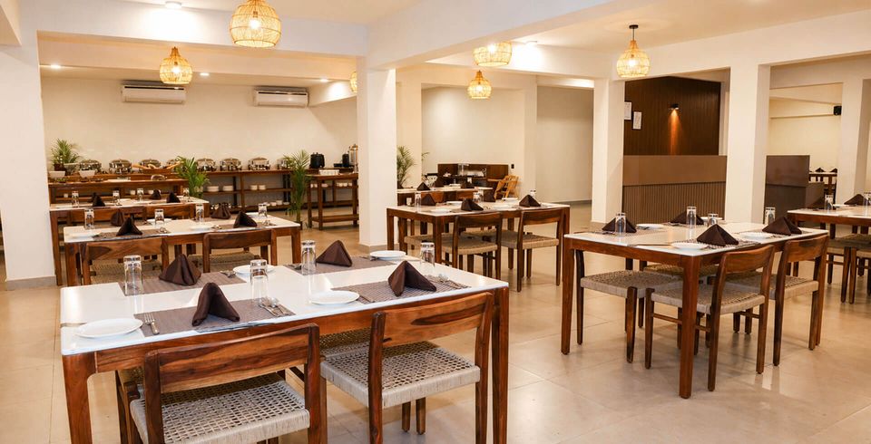 Restaurant seating with garden-facing windows