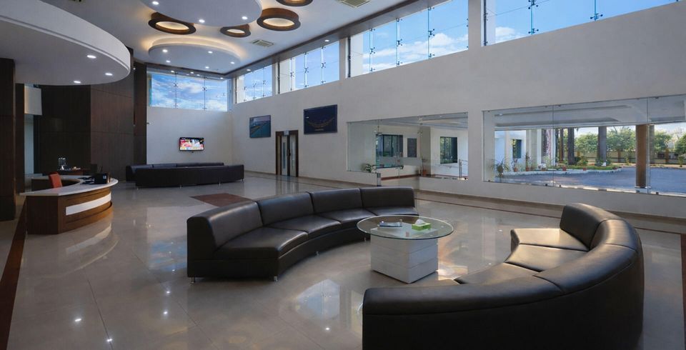 High-ceilinged lobby with curved seating