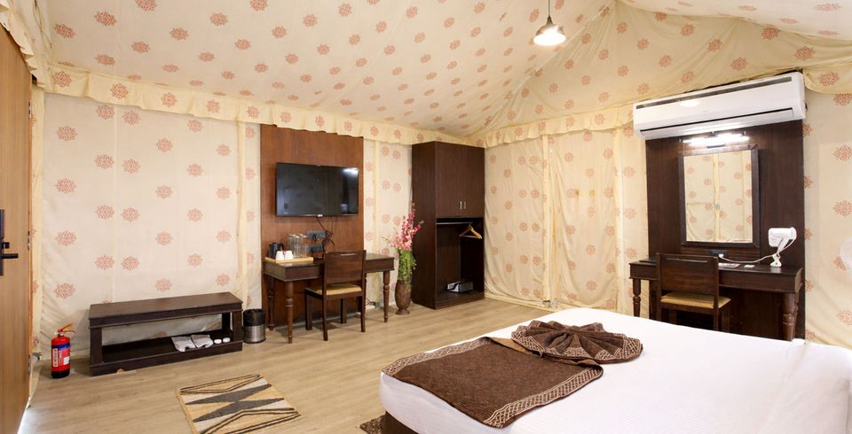 Tent bedroom with a sitting area