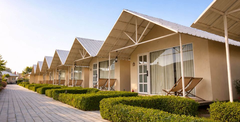 Pitched-roof accommodation beside a garden path