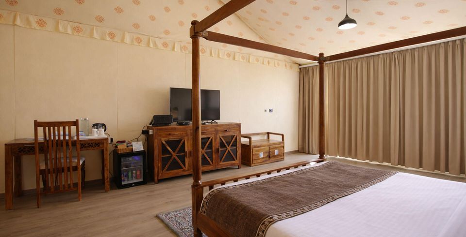 Guest bedroom beneath a patterned ceiling