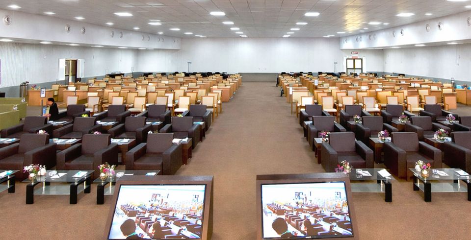 Conference seating arranged in a spacious hall