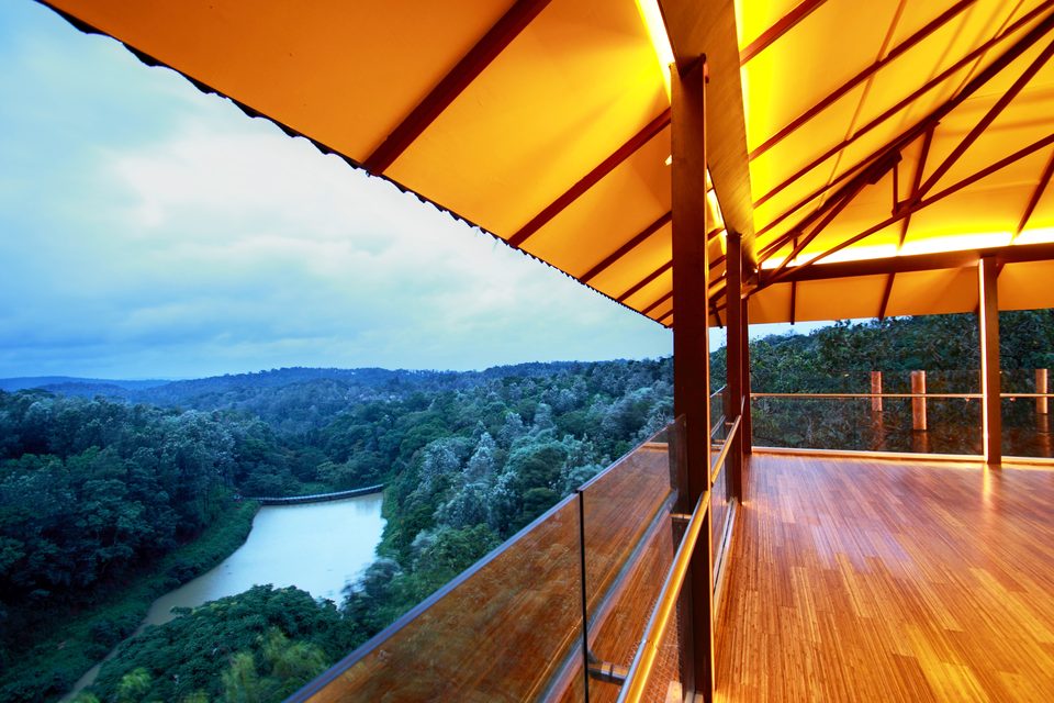 Covered timber viewing deck above a lake and forest