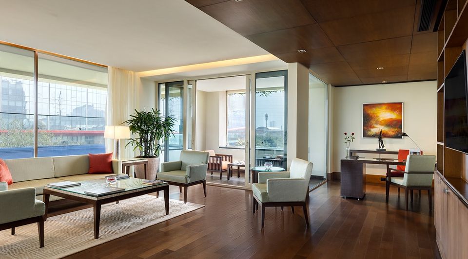 Suite living and dining room with corner windows