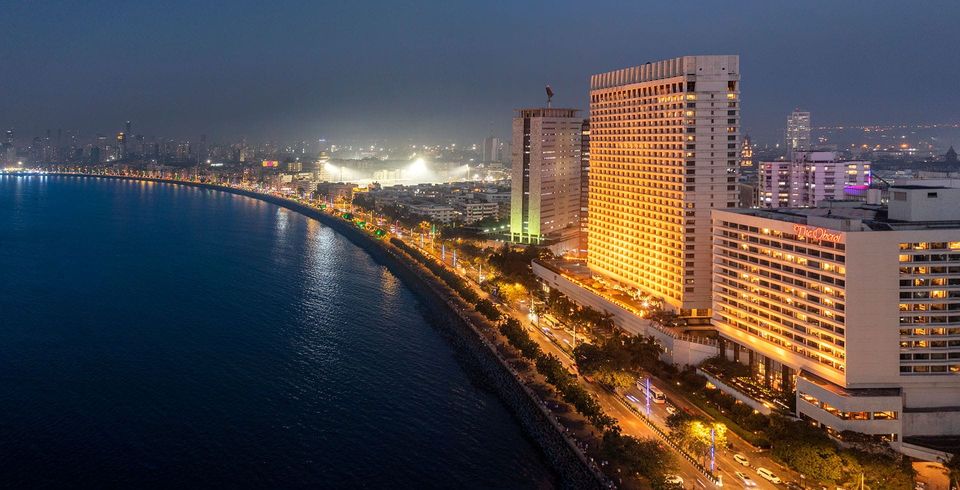 Hotel facade and Marine Drive illuminated at night