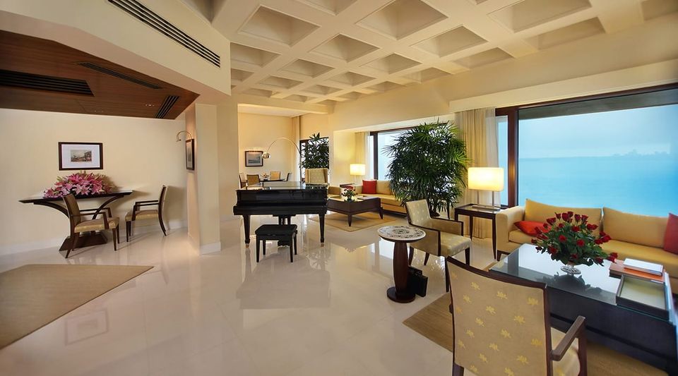 Suite living room with a grand piano and sea view